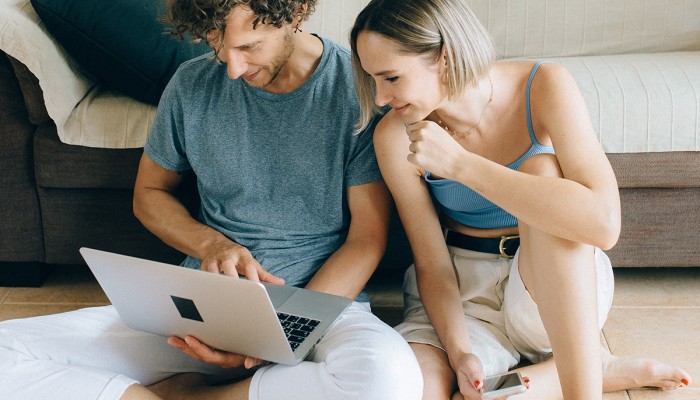 Couple in Front of Laptop