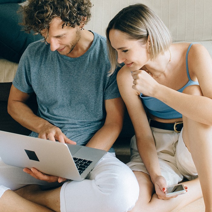 Couple in Front of Laptop